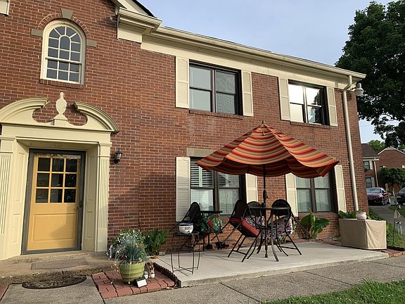 View of front of building and unit in top right.