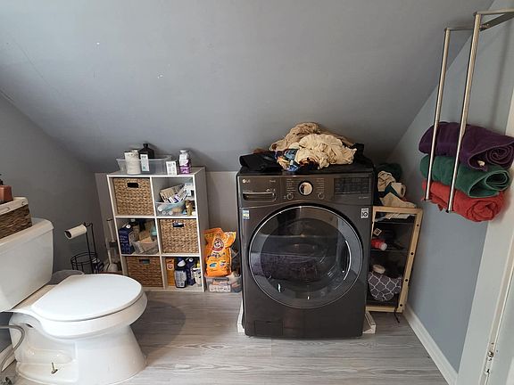 Upstairs full bath: features a washer/dryer combo. (Basement also has much larger individual washer and dryer)