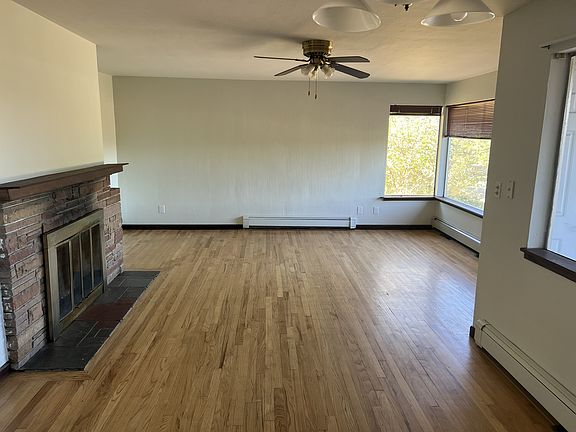 upstairs living room, hardwood floors throughout living room and two bedrooms