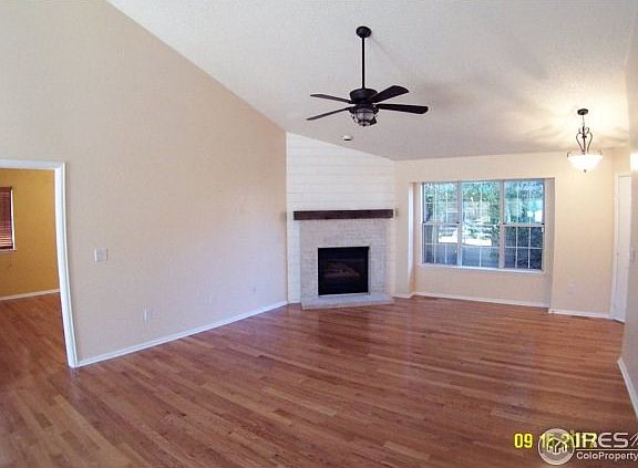 Spacious living room with hard wood floors