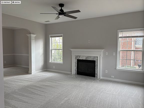 Living Room With Gas fireplace and Ceiling Fan