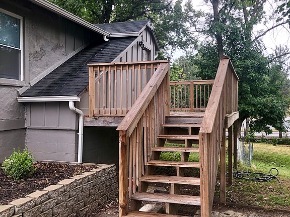 Back/Side deck with doorway off the kitchen.