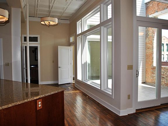 Living area and master BR open onto private patio.