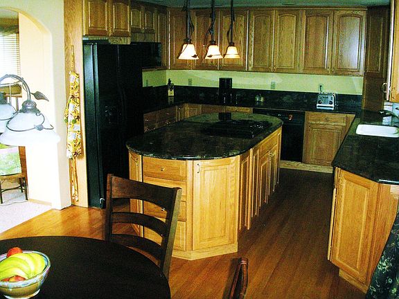 The kitchen was remodeled and has beautiful cabinets and slab granite counters