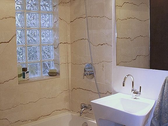 Remodeled bathroom with Italian marble, European sink, eco-f