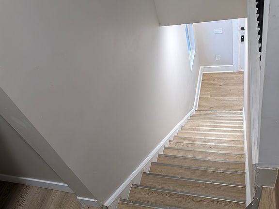 Another view from top of stairs with storage closet visible at the top