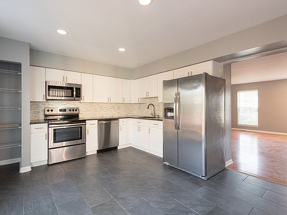 Stainless steel appliances, granite countertops.