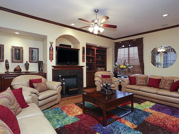 The living area is on the second floor. The gas log fireplace provides a natural focal point for fur