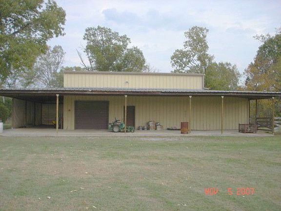 46x56 metal building concrete flooring, electricity, 2 drive-thru doors 