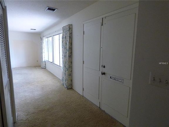 Double door entry with hall closet and the great room to the right.