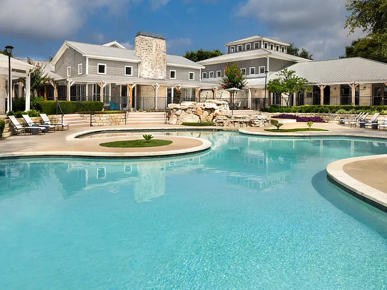 Resort-styled swimming pool with sun deck