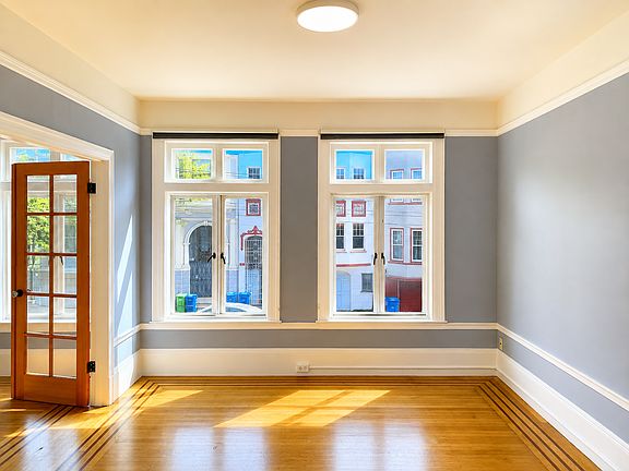 Living room with new LED light fixture and hardwood floor