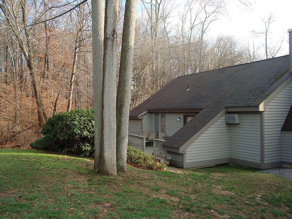 Detached condo nestled by the woods.