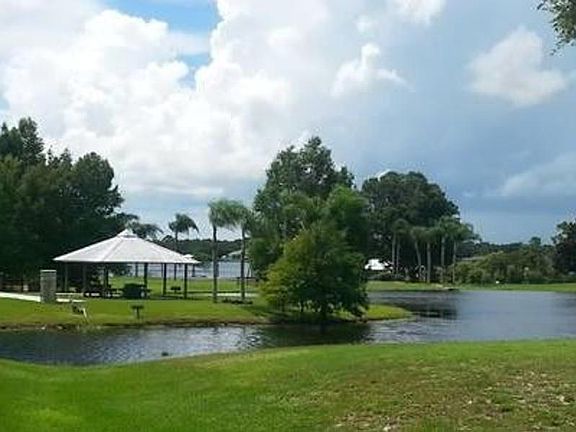 This is another view from the back of the house. There is an island with picnic tables, a grill and shuffleboard courts.