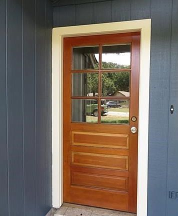 Custom cottage-style wood front door with cherry finish
