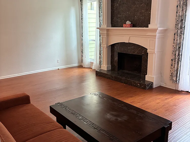Living room with a wood burning fireplace