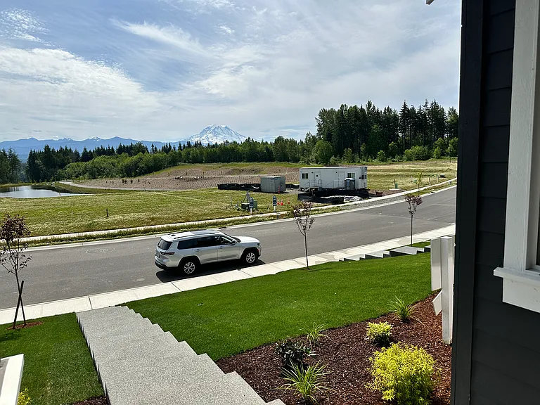 Unobstructed Mt. Rainer view from the front porch, 1st level living room and 2nd level bonus room.