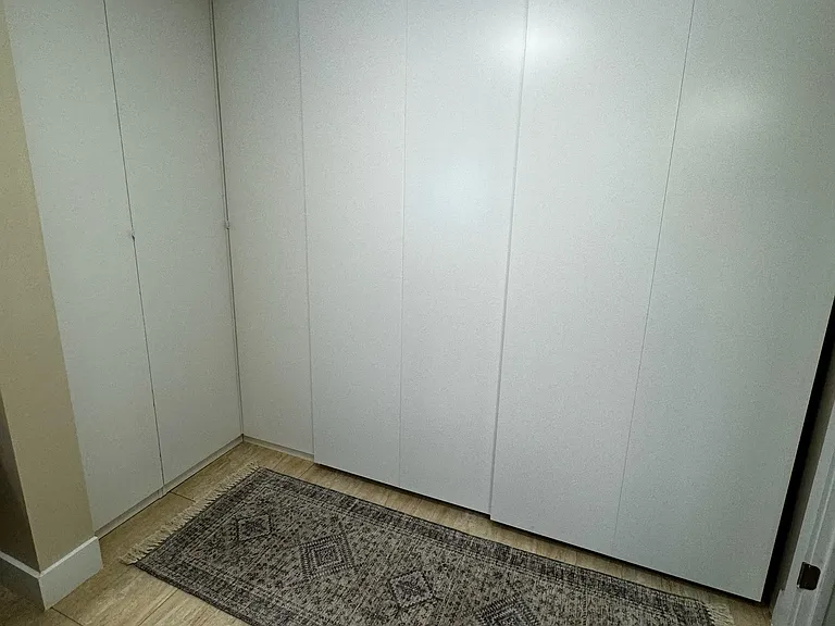 Dream Closet with tons of extra storage in custom ceiling closets