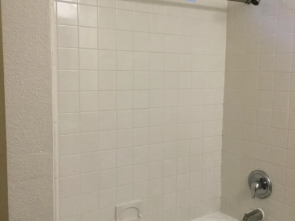 TUB AND SHOWER COMBO AT BOTH BATHROOMS