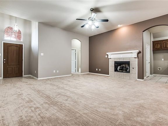 Large Greaat Room with updated fan, fireplace with gas logs.