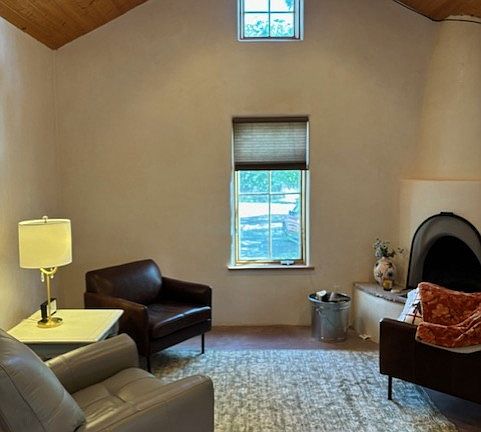 Living room space with working fireplace. Main heating is radiant heat and not the fireplace. This fireplace is used for ambiance.