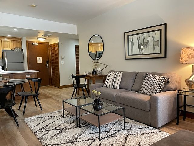 Living room with American Leather sleeper sofa. New LVP flooring.