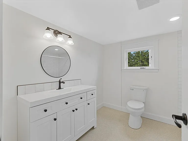 Upstairs primary suite 3/4 bath (shower to the right)