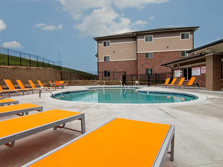 Our west clubhouse offers residents a second resort-style pool with lounge seating and hot tub.