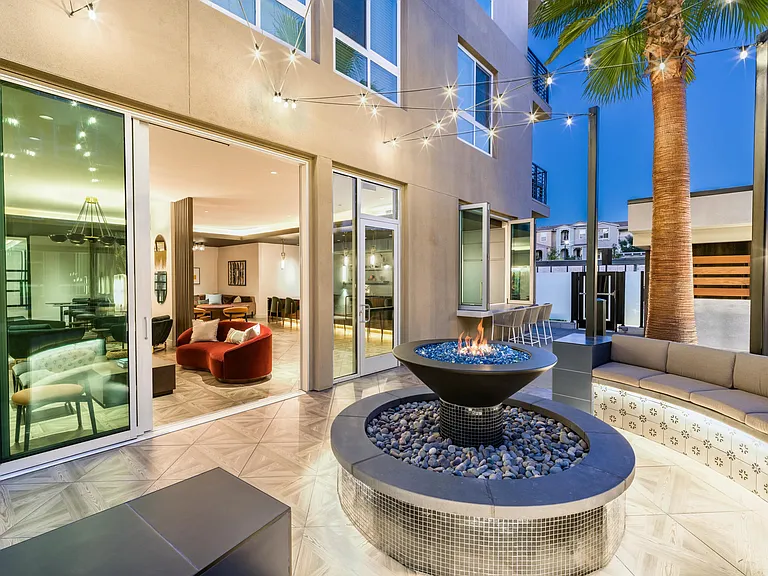 Enjoy a cozy fire pit near the pool at Modera Pomona for a relaxing outdoor experience.