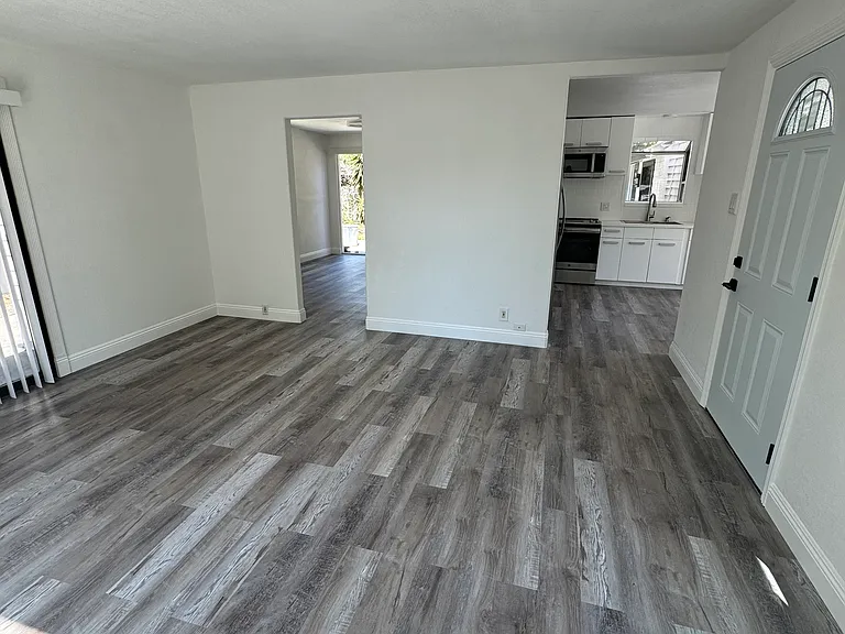 View from front window towards master and kitchen.