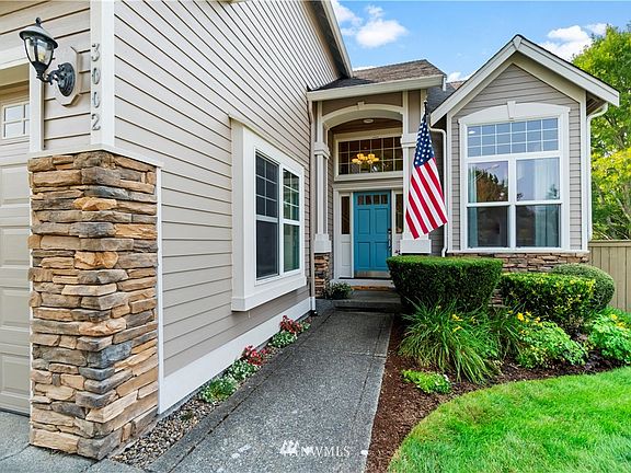 The cheery front door welcomes you to this lovely home