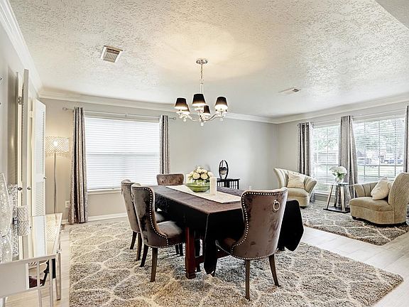 The formal living and dining rooms are large and filled with natural light.