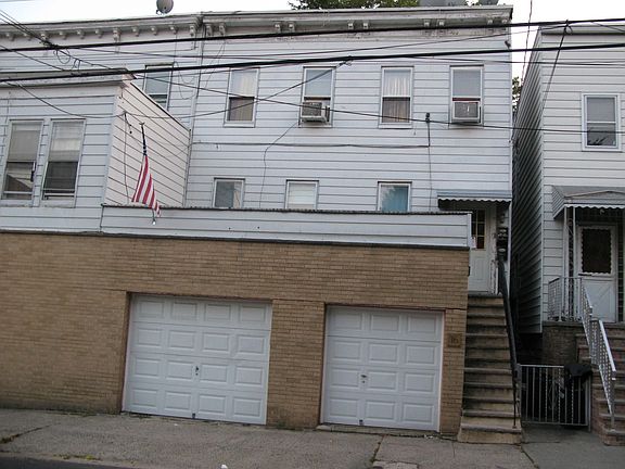 Front - 2 car garage on left, storage on right