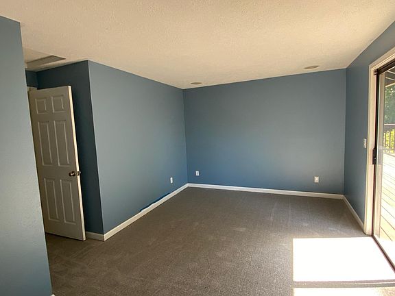 Upper level bedroom with sliding glass door to deck en suite bathroom