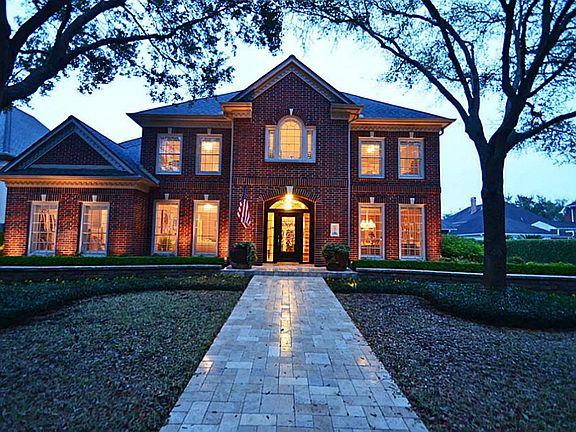 THE  PROFESSIONAL LANDSCAPING ON THIS HOME IS SUPERB! IT INCLUDES STONE WALKWAY,LUSH BEDS & STUNNING STONE WALLS!