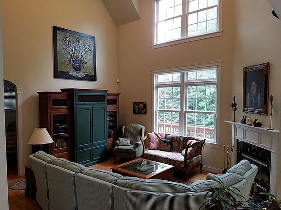 Great Room : 18 foot ceilings, natural gas fireplace, view of wooded backyard.