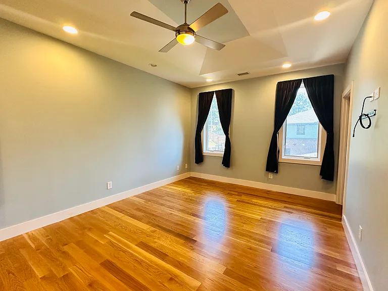 This is the large main bedroom located on the second floor overlooking the backyard.