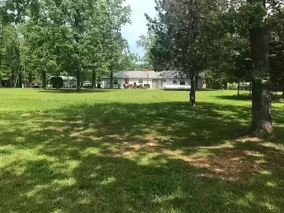 Rear of home and view of back yard
