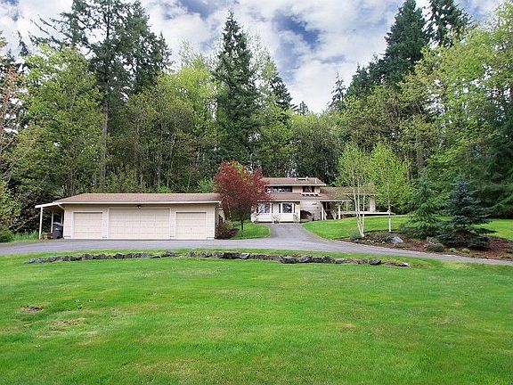 Circular driveway, gorgeous landscaping, 4 car garage with workbench, plus an attached carport for boat or small RV parking, and just a short walk to the Tolt Pipeline trail