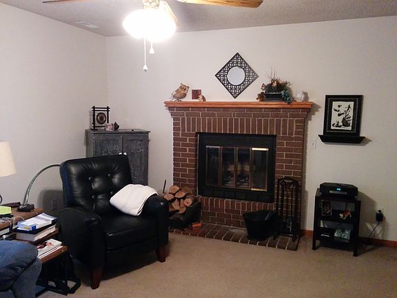 Living room has wood burning fireplace
