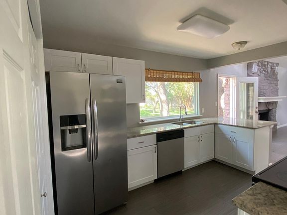 Updated kitchen with granite countertops, walk-in pantry pantry and stainless appliances.