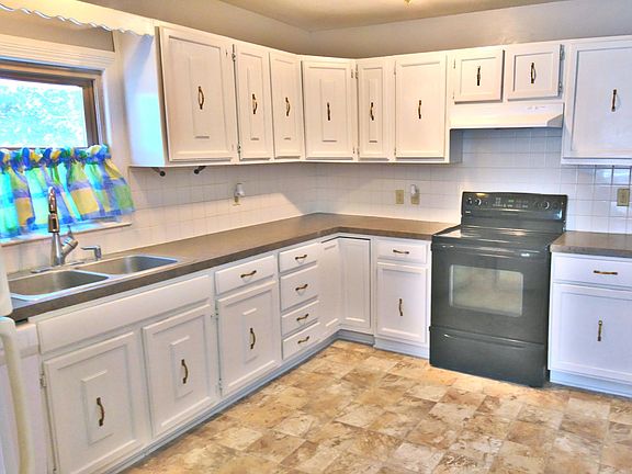 Kitchen with stove, dishwasher, and frig