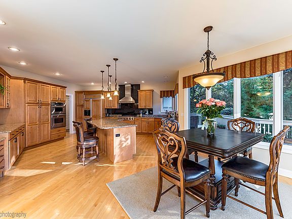 HUGE! Has table space and large island! TONS of cabinets!