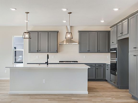 The gourmet kitchen offers plenty of counterspace and storage for your culinary endeavors