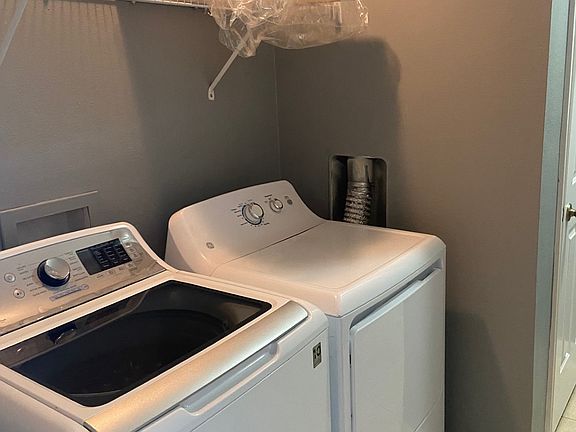 Laundry room with storage