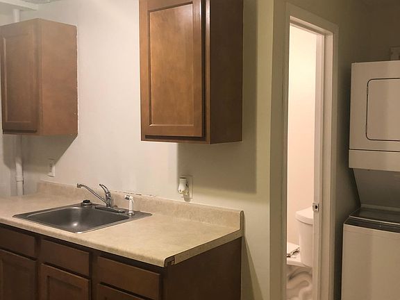 Kitchen with view to bathroom, washer and dryer