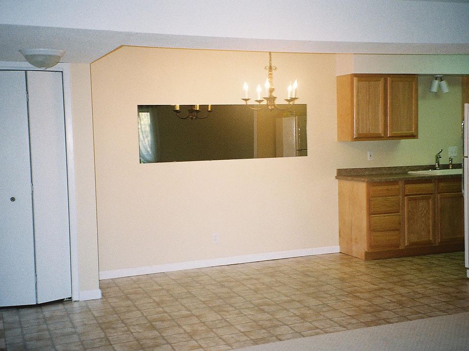 LEFT OF PIC 1; a section of entry closed, din area, South wall of kit.