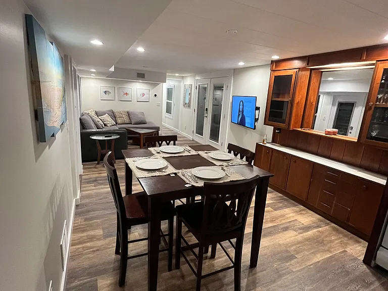 From the Kitchen area looking back toward the family room and main entrance. Remodelled and updated a couple years ago this place is bigger than it looks! Notice the 1950's style bar that we chose to keep. We love the character!!