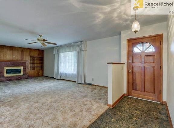 Front entry and large living room with fireplace.