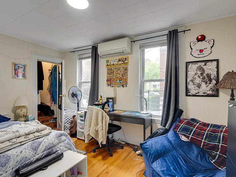 Front left bedroom with walk in closet with windows.